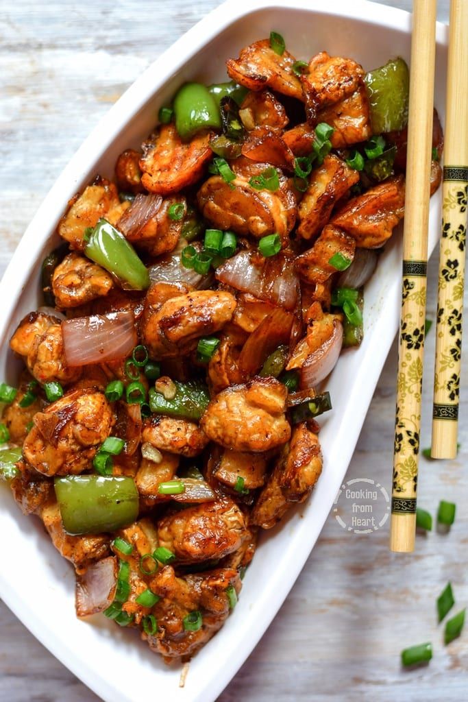 Overhead view of a platter of dry mashroom manchurian.