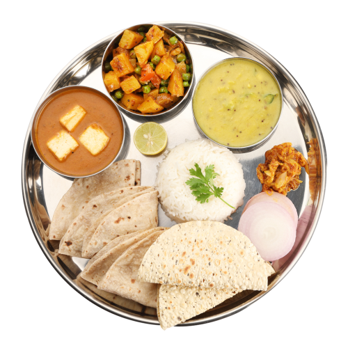 Traditional Indian veg thali platter with paneer masala, aloo matar, dal, rice, and chapati.